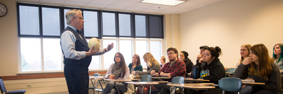 Students listen as their professor teaches.