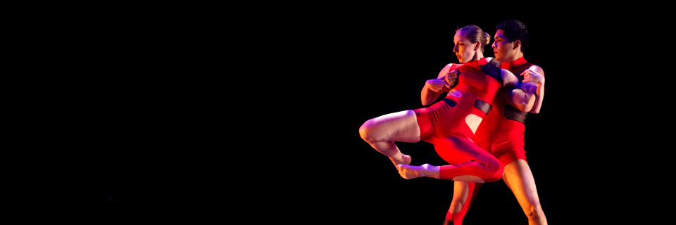 Two Illinois State dancers performing.
