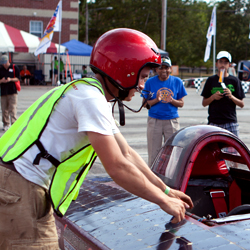 Student prepares to test out his solar powered car.